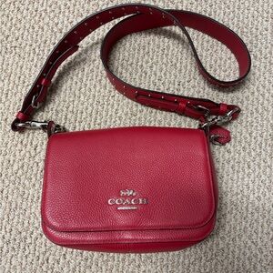 Red Coach purse with studded strap